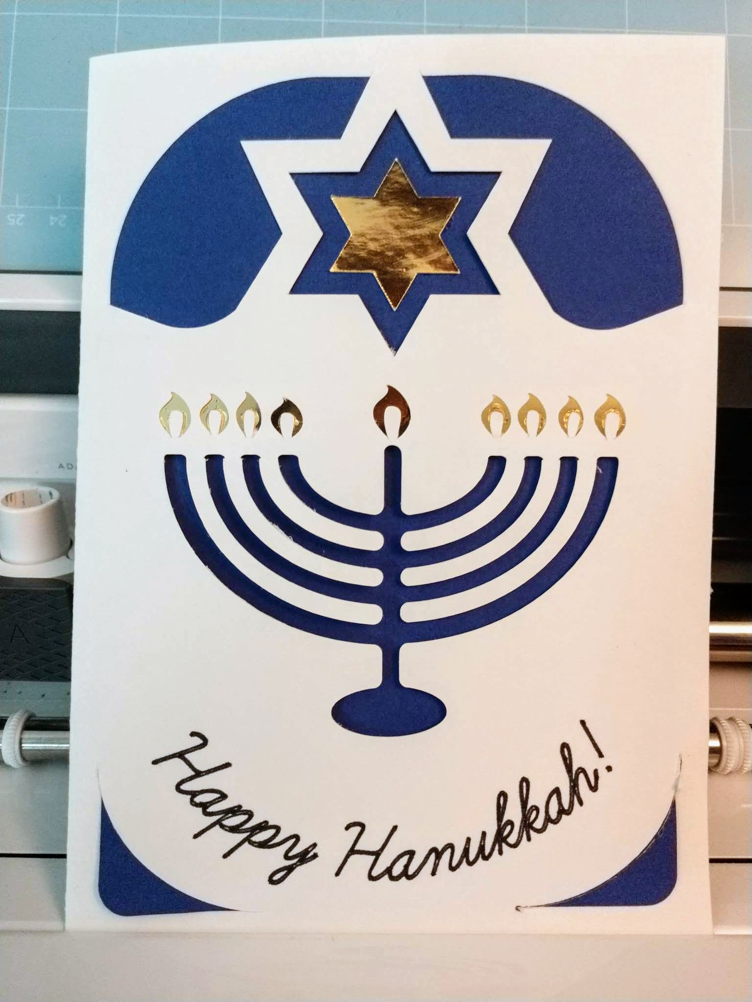 Stylized menorah with gold flames, and a gold and blue star of David above