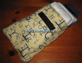 Diaper case, open, contents half-out