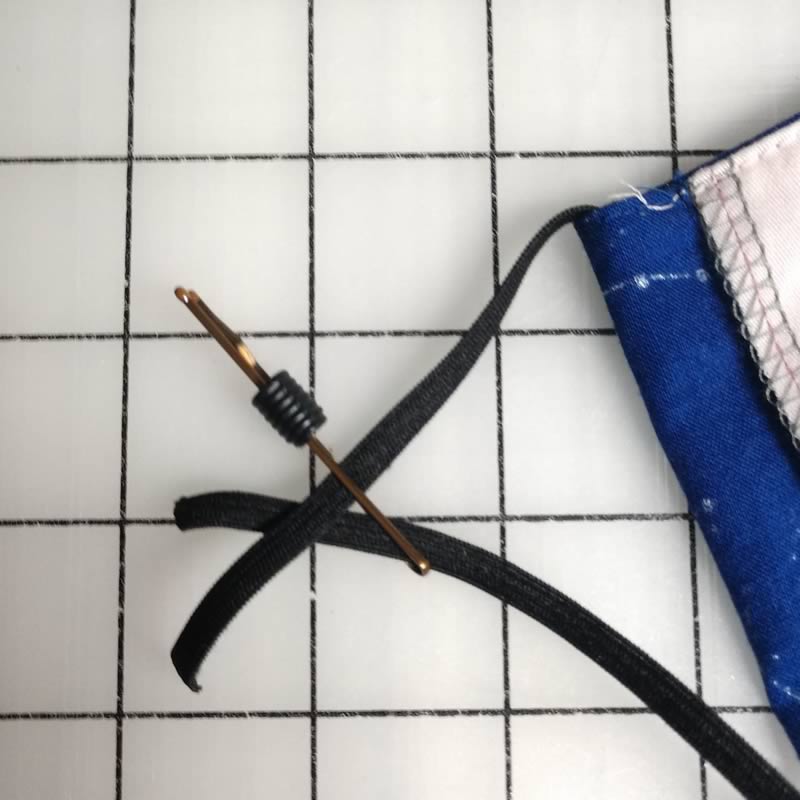 Thread the elastic through the included silicone cord stopper.